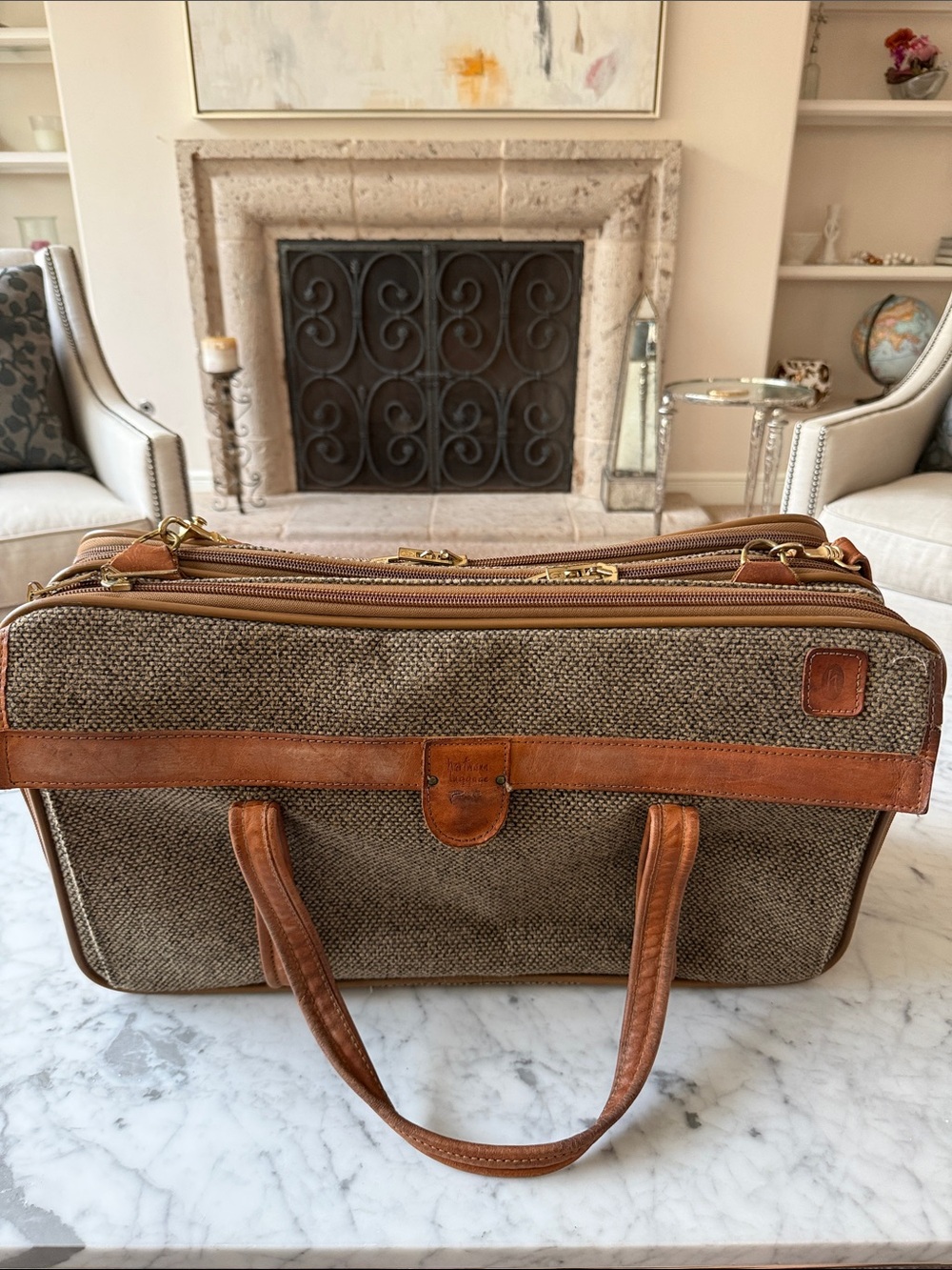 Vintage Hartmann brown tweed carry on bag with leather accents.
